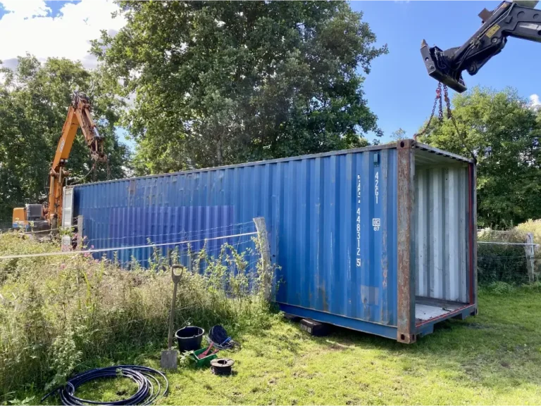 A dry, organised container: ventilation, moisture control and shelving do most of the work.