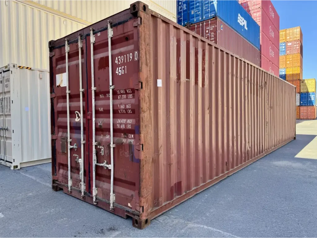 A one-trip container (left) and a used wind and watertight unit. Both keep weather out; the difference is paint life, appearance and history.